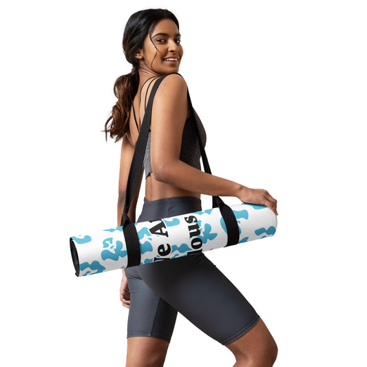 girl holding we are fierce yoga mat